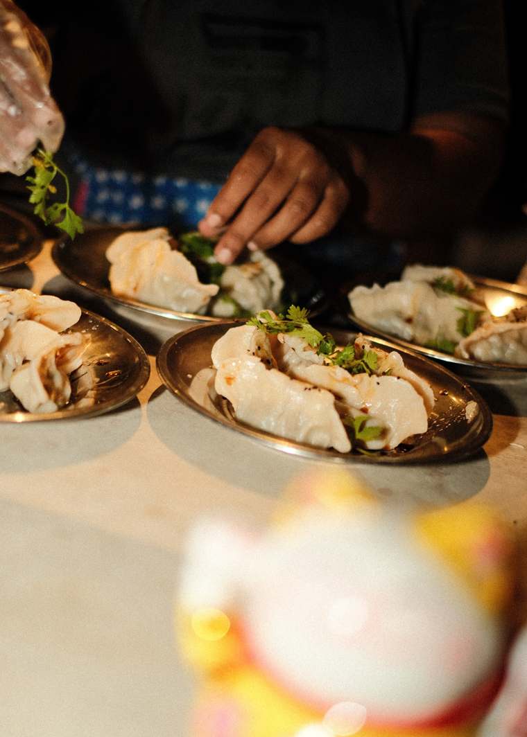 Plates of boiled dumplings on the counter