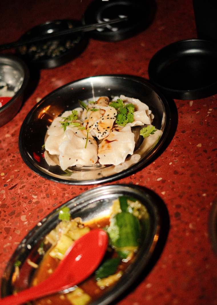 Dumplings in chilli oil with smashed cucumber